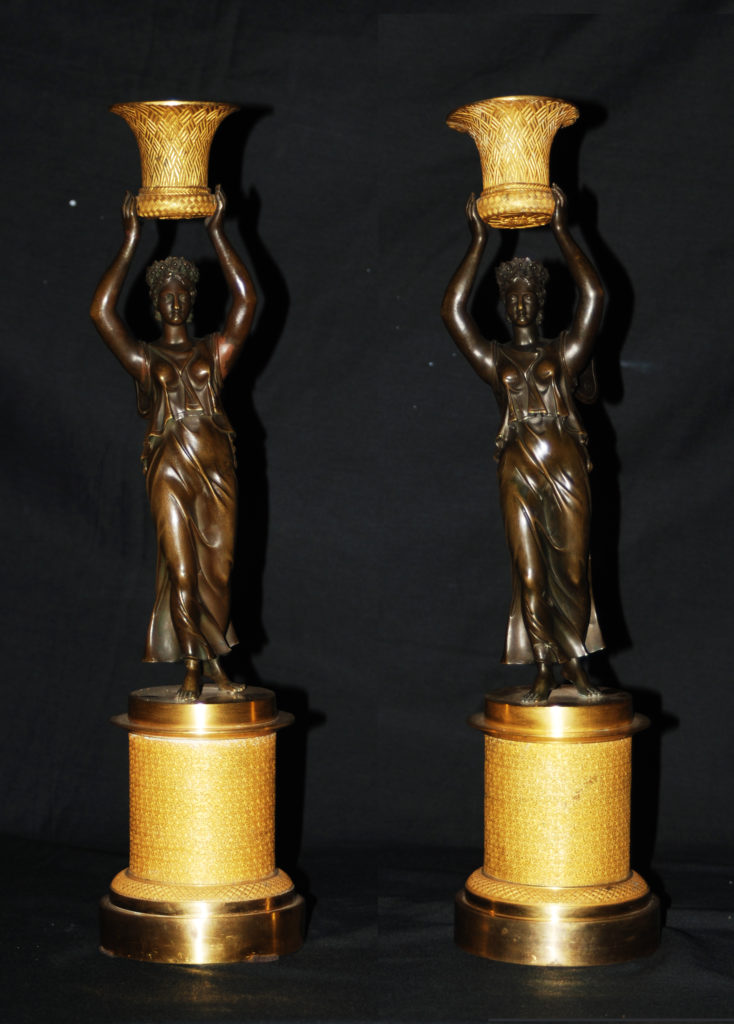 A pair of "Vittorie Alate" candlesticks